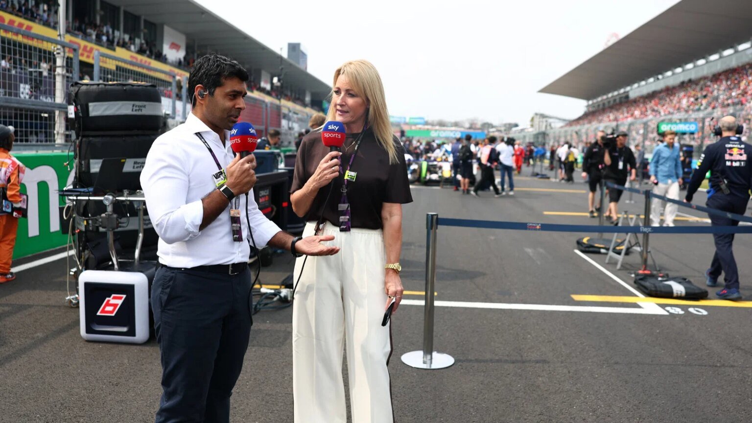 Karun Chandhok and Rachel Brookes on the F1 grid in Japan