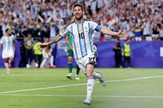 Lionel Messi celebrates record breaking goal