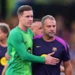 Marc-Andre Ter Stegen of FC Barcelona embraces Hansi Flick