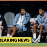 Reece James watches on from the England bench