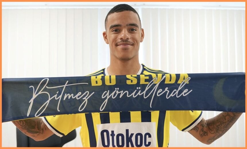 Mason Greenwood poses with a Fenerbahce scarf