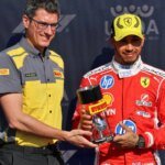 Hamilton is presented with the sprint pole trophy