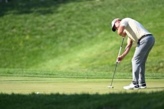 Glover shoots a 65 to take a two-shot lead at the John Deere Classic