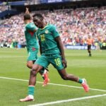 Ismaila Sarr celebrates after scoring vs Belgium