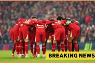 Liverpool players huddle before game
